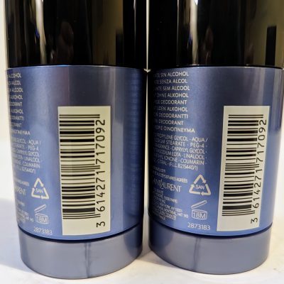 Two deodorant containers are placed side by side, showing labels with product information, barcodes, and ingredients listed in multiple languages.