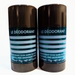 Two black cylindrical containers of "Le Déodorant," labeled as alcohol-free deodorant sticks, each containing 75 ml (2.6 oz) of product.