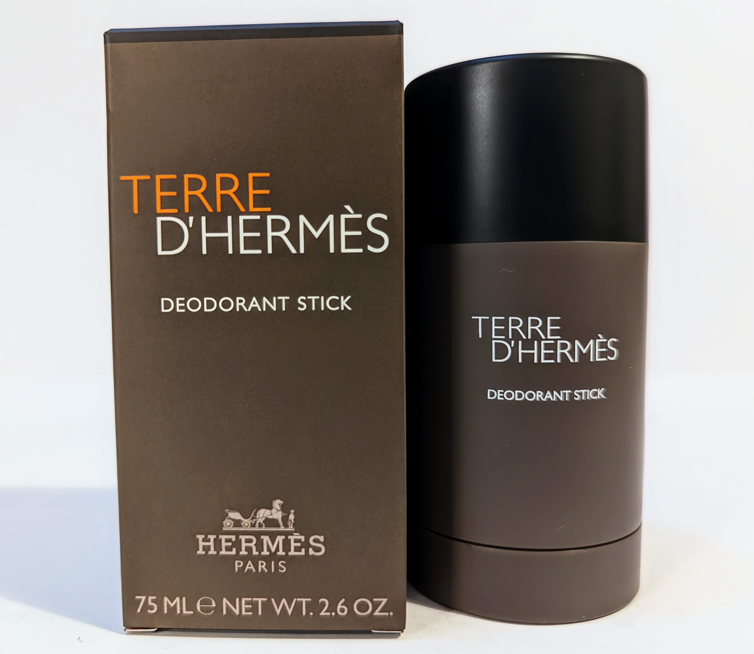 Image of Terre d’Hermès deodorant stick, 75ml, displayed next to its brown and orange packaging.
