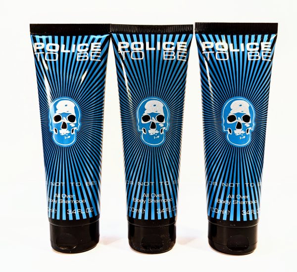 Three tubes of "Police To Be" all over body shampoo in 3.4 fl oz size with blue and black designs featuring a skull graphic on each tube.