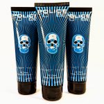 Three tubes of "Police To Be" all-over body shampoo with a blue skull design on the packaging, each containing 3.4 fluid ounces.