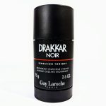 A black cylindrical container of Drakkar Noir deodorant by Guy Laroche, labeled "Sensation Tonique," with a net weight of 75g (2.6 oz).