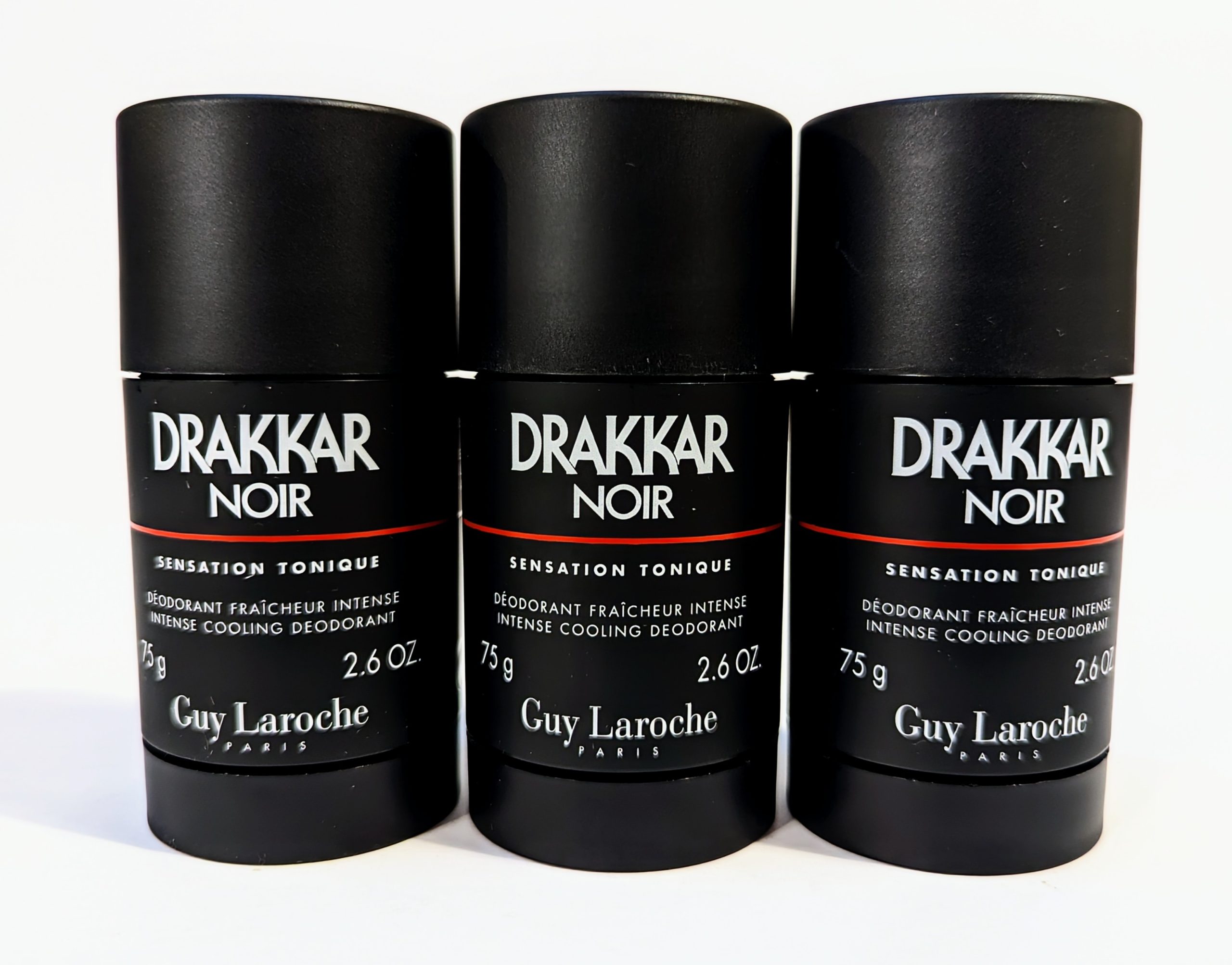 Three black 75g containers of Drakkar Noir Intense Cooling Deodorant by Guy Laroche are aligned side by side, showcasing the front labels.