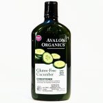 A bottle of Avalon Organics Gluten-Free Cucumber Conditioner with a dark green body and label, featuring sliced cucumbers and description text highlighting its organic and gluten-free properties.