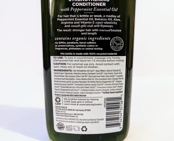 A bottle of strengthening conditioner with peppermint essential oil. The label lists ingredients, benefits, usage instructions, and cautionary information. Barcodes and certification logos are at the bottom.