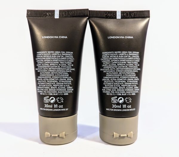 Two black cosmetic tubes labeled "London via China," containing 30ml (1 fl oz) each. Ingredients and product details are listed on the back.