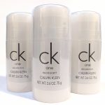 Three 2.6 oz sticks of Calvin Klein CK One deodorant are arranged side by side.