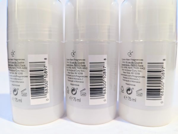 Three Calvin Klein fragrance bottles are shown in a row, displaying identical labels with barcodes and product information. Each bottle contains 75 ml.