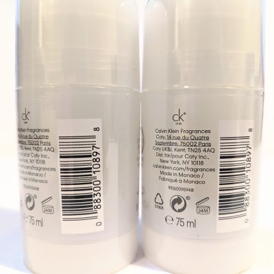 Two white bottles of Calvin Klein fragrance, each with a barcode and product description printed on the back label. Each bottle has a capacity of 75 ml.