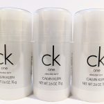 Three bottles of Calvin Klein CK One deodorant, each with a net weight of 2.6 oz (75 g), are displayed side by side against a white background.