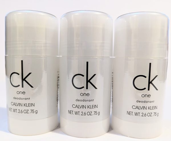 Three bottles of Calvin Klein CK One deodorant, each with a net weight of 2.6 oz (75 g), are displayed side by side against a white background.