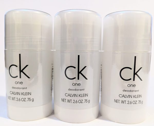 Three bottles of Calvin Klein CK One deodorant, each with a net weight of 2.6 oz (75 g), are displayed side by side against a white background.