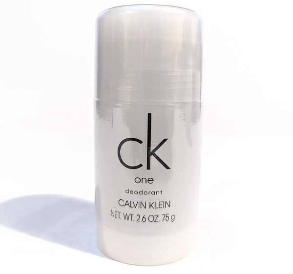 A clear plastic deodorant stick labeled "ck one Calvin Klein" with a net weight of 2.6 oz (75 g) against a white background.