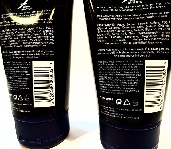 Two black bottles of shower gel with ingredient lists, barcodes, and usage instructions displayed on the back view. One bottle's text reads 'blue stratos', and both have white labels.