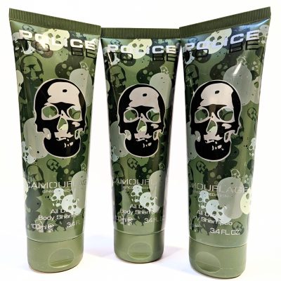 Three green tubes of Police Camouflage Edition all-over body shimmer with skull designs on the front, each containing 100 mL (3.4 FL OZ).