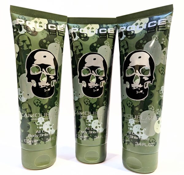 Three green tubes of Police Camouflage Edition all-over body shimmer with skull designs on the front, each containing 100 mL (3.4 FL OZ).