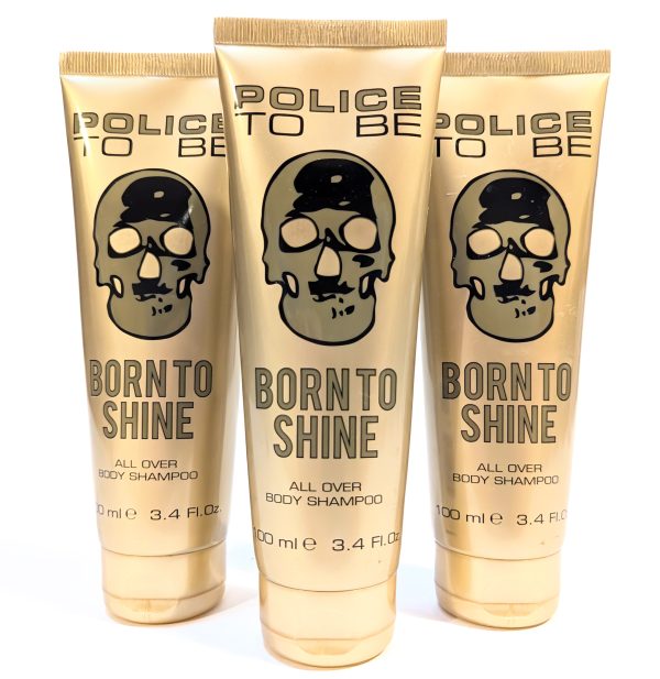 Three gold-colored tubes of "Police To Be Born To Shine All Over Body Shampoo," each containing 3.4 fl. oz (100 ml), are displayed with a skull design and black text on the packaging.