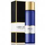 A blue cylindrical shower gel bottle with a gold cap labeled "Carolina Herrera Good Girl Shower Gel for her 200ml" stands next to its matching black and gold box.