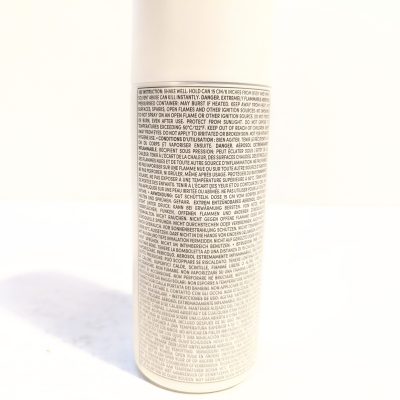 A close-up of a cylindrical container with a large block of small, densely packed text covering the entire visible side.
