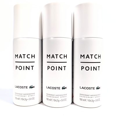 Three white bottles of Lacoste Match Point deodorant spray are displayed in a row. Each bottle is labeled with "MATCH POINT" in bold letters and the Lacoste logo.