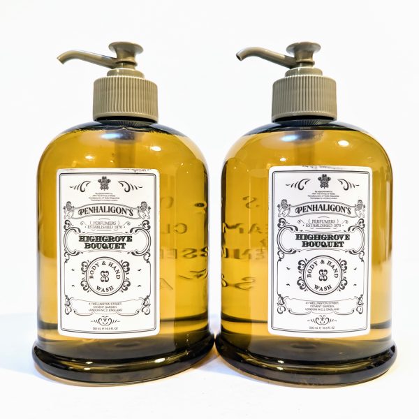 Two bottles of Penhaligon's Highgrove Bouquet hand and body wash with pump dispensers, featuring a detailed label and filled with amber-colored liquid.