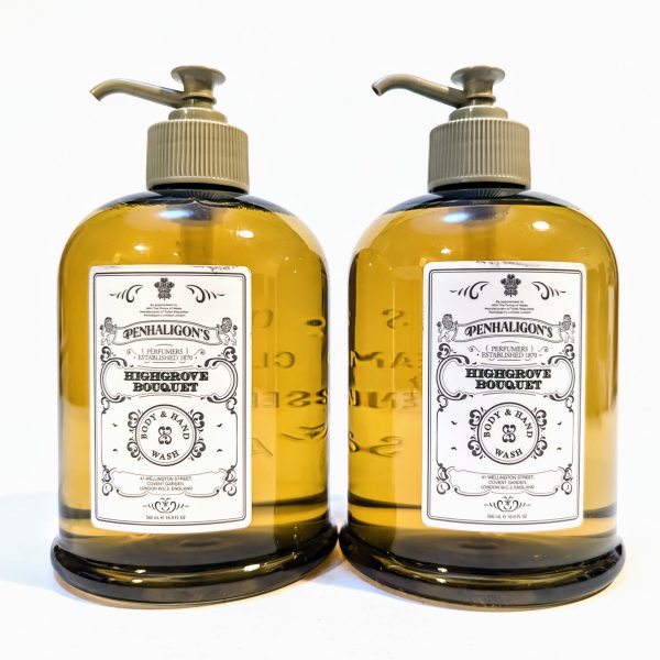 Two bottles of Penhaligon's Highgrove Bouquet hand and body wash with pump dispensers, featuring a detailed label and filled with amber-colored liquid.