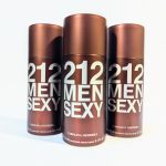 Three bottles of "212 Men Sexy" deodorant spray by Carolina Herrera are displayed side by side, with a brown and silver design.