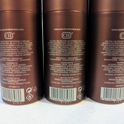 Three brown cylindrical containers of Carolina Herrera deodorant with detailed product and ingredient information printed on the back.