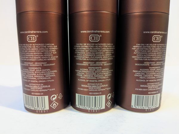 Three brown cylindrical containers of Carolina Herrera deodorant with detailed product and ingredient information printed on the back.