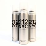 Three silver spray cans of Carolina Herrera 212 NYC refreshing deodorant are standing upright against a plain white background.