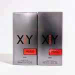 Two boxes of Hugo XY eau de toilette for men, each 100 ml, in grey packaging with "Hugo" in red and "XY" in black letters.