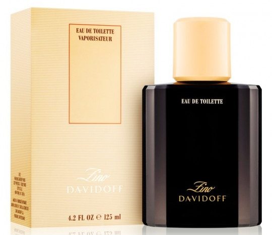 A bottle of Davidoff Zino 125ml EDT Eau de Toilette Spray for Men and its packaging box. The bottle is black with a golden cap and golden label, while the box is beige with text. The volume is 4.2 fl oz or 125 ml.