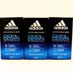 Three boxes of Adidas Cool Down shower bar, featuring wild mint essential oil, 97% natural ingredients, and labeled as vegan and plastic-free. Each box is 100g.