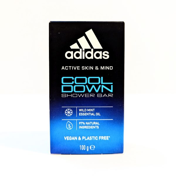 A box of Adidas Cool Down Shower Bar, featuring wild mint essential oil, with 97% natural ingredients. The packaging also states it is vegan and plastic-free, weighing 100 grams.