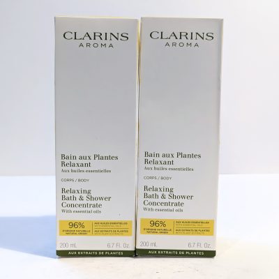 Two Clarins Aroma Relaxing Bath & Shower Concentrate boxes, each containing 200 ml. The packaging highlights essential oils and states 96% natural origin ingredients.