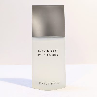 A bottle of L'Eau d'Issey Pour Homme by Issey Miyake, featuring a sleek design with a frosted glass body and a metallic cap.