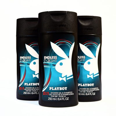 Three bottles of Playboy Endless Night 2-in-1 shower gel and shampoo, 250 ml size, with a black and blue design featuring a white rabbit logo.