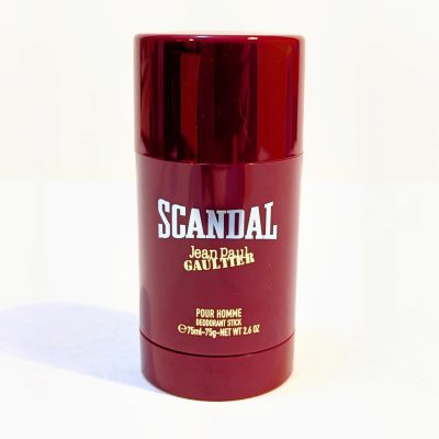 Red cylindrical deodorant stick with "Scandal" and "Jean Paul Gaultier" printed in white font. Contains 75ml/2.6 oz for men.