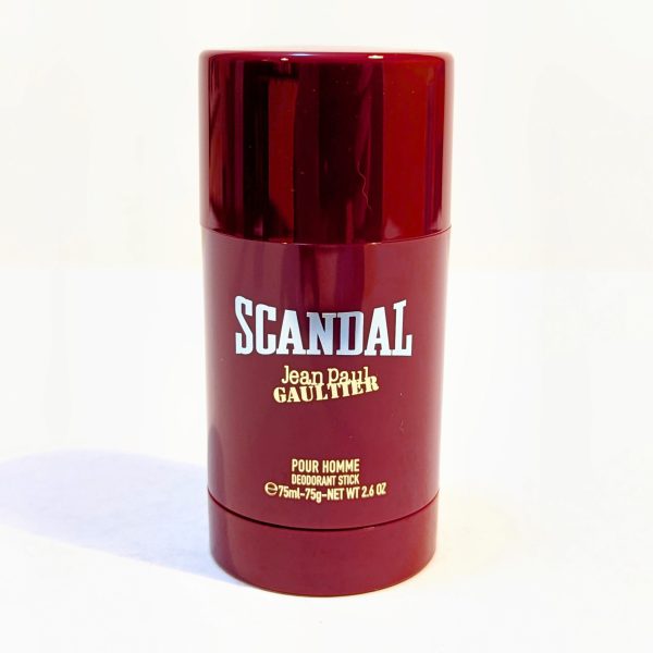 Red cylindrical deodorant stick with "Scandal" and "Jean Paul Gaultier" printed in white font. Contains 75ml/2.6 oz for men.