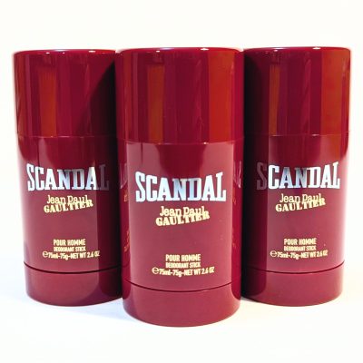 Three red Jean Paul Gaultier Scandal deodorant sticks, 2.6 oz each, arranged in a row against a light background.