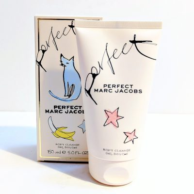A 150ml tube and box of Marc Jacobs Perfect Shower Gel Body Wash for Women, featuring minimalist blue cat and pastel star illustrations with handwritten-style text.