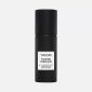 A black cylindrical spray bottle labeled 