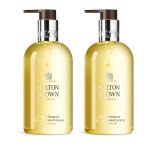Two bottles of Molton Brown Orange & Bergamot Hand Wash 300ml with pump dispensers, each containing yellow liquid.