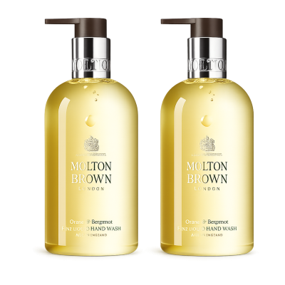 Two bottles of Molton Brown Orange & Bergamot Hand Wash 300ml with pump dispensers, each containing yellow liquid.