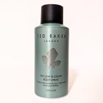 A bottle of Ted Baker London Fig Leaf & Cedar body spray, 150 ml, with a dark cap. The label mentions fig leaf, cedar leaf, and black pepper fragrance.