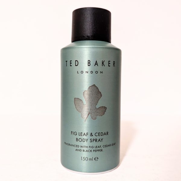 A bottle of Ted Baker London Fig Leaf & Cedar body spray, 150 ml, with a dark cap. The label mentions fig leaf, cedar leaf, and black pepper fragrance.