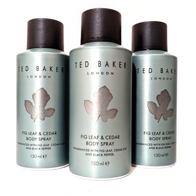 Three bottles of Ted Baker Fig Leaf & Cedar body spray, each 150 ml, arranged in a row against a white background.