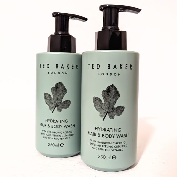 Two bottles of Ted Baker London Hydrating Hair & Body Wash, 250 ml each, with hyaluronic acid, featuring a leaf design on the label.