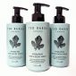 Three bottles of Ted Baker Hydrating Hair & Body Wash, each with a black pump and a leaf illustration on a light green label. Each bottle contains 250 ml.