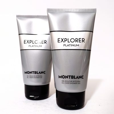 Two silver tubes of Montblanc Explorer Platinum shower gel stand upright on a white surface, displaying brand and product details.